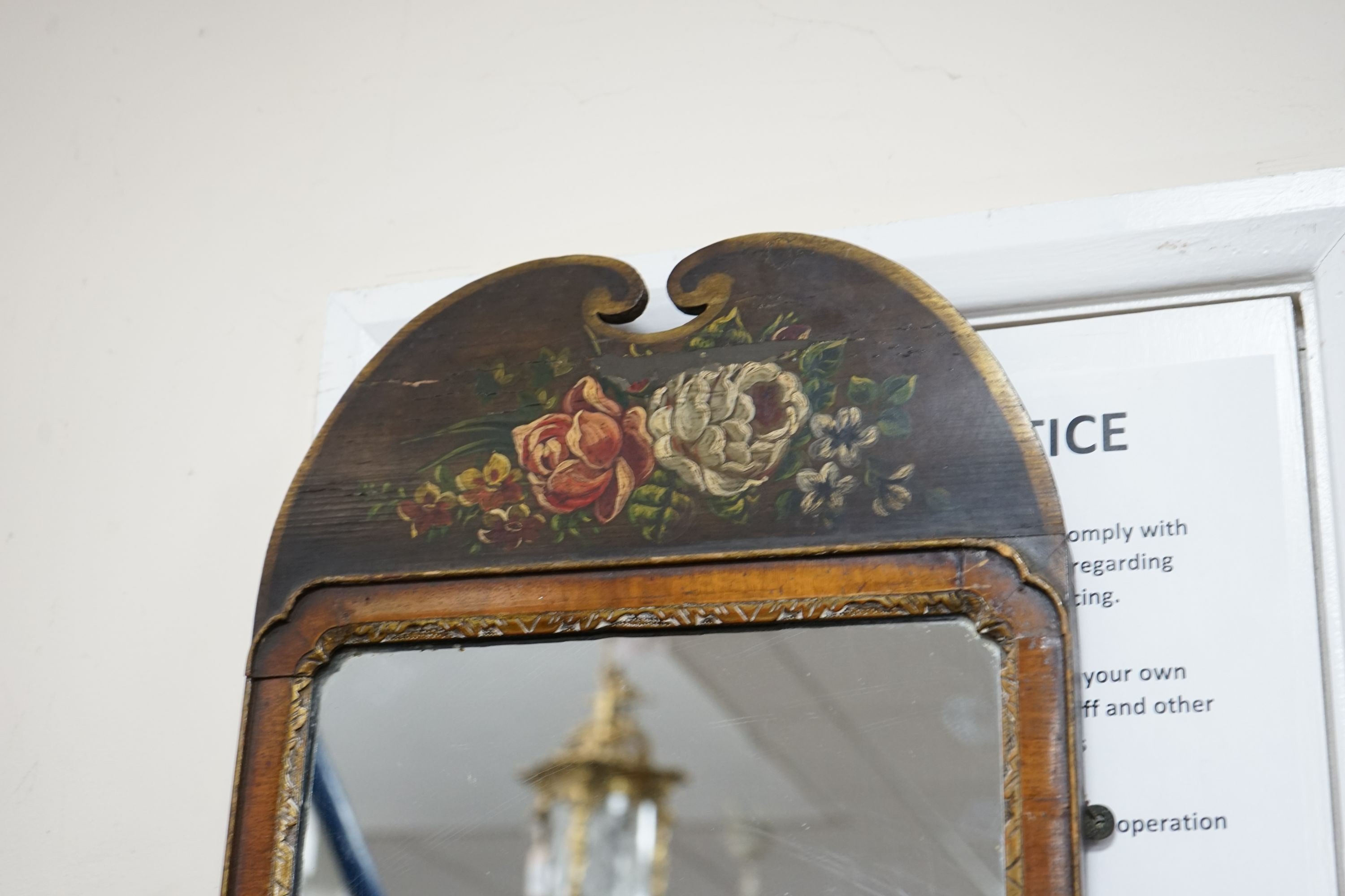 An 18th century style painted parcelgilt walnut wall mirror, width 36cm, height 76cm